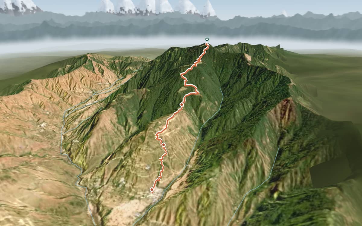 Satellite view from above Pantwari looking east: the trail climbs through terraced fields and forest from the village in the foreground to the base camp and on up the ridge to Nag Tibba Summit, with the snow peaks of the Garhwal Himalaya along the north-eastern skyline